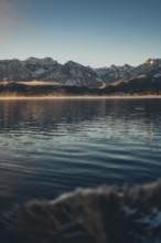 Frosty morning atmosphere during sunrise at Lake Hopfensee in the Allgäu in Bavaria, Germany,