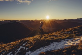 Trail running in autumn on the Jochberg on Lake Walchensee against the wonderful backdrop of the