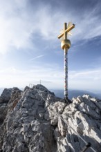 Golden summit cross on the summit of the Zugspitze, Wetterstein range, Bavaria, Germany, Europe