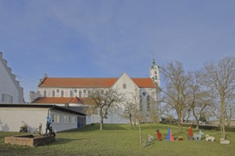 Monastery church of St Peter and Paul and nativity scene figures in the garden, monastery,