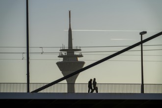 Pedestrians on the Oberkassler Rhine Bridge, Rhine Tower, Düsseldorf, North Rhine-Westphalia,