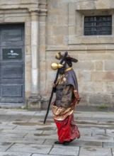 Pilgrims on the Way of St James in front of Santiago de Compostela Cathedral Spain