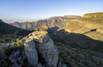 Sunset at Blyde River Canyon with Three Rondawels peak, view of canyon with Blyde River and Mesa