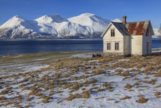 Old house, dilapidated, fjord, mountains, sunny, winter, Lyngen Alps, Norway, Europe