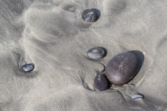 Polished lava stones on the beach, Playa de Famara, Lanzarote, Canary Islands, Spain, Europe