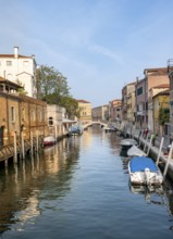 Motorboats and colourful house facades on a canal, Venice, Veneto, Italy, Europe