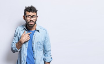 Confused man pointing at himself, confused person pointing at himself isolated, confused people