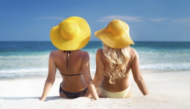 Two young woman on the beach in the Caribbean, Studio