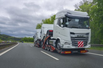 Car transporter loaded with brand-new lorries on the A6 motorway, Bavaria, Germany, Europe