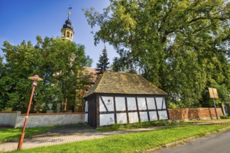 Former fire station in front of the church, Wartenburg Kemberg, Saxony-Anhalt, Germany, Europe