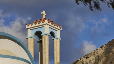 Saint Filimon church, detail of the church towers with a cross, blue sky in the background,