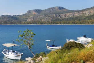 Sea view with several boats, surrounded by mountains in clear, sunny weather, Agia Kyriaki,