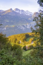 Panoramic view of alpine landscape with autumn forest and road in the valley, Lauterbrunnen,