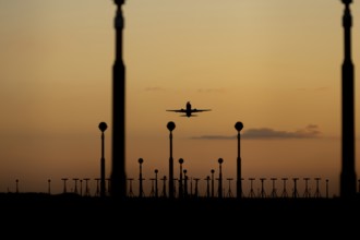 Boeing 737 aircraft taking off at sunset from London Stansted airport, Essex, England, United