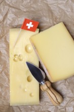 A piece of Swiss Emmental cheese and the Swiss flag