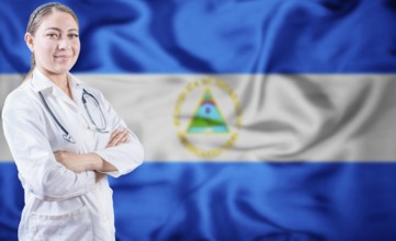 Doctor with crossed arms on Nicaragua flag background. Doctor with stethoscope on Nicaraguan flag.