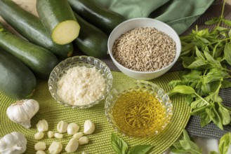 Pesto ingredients, courgette, sunflower seeds, cheese, olive oil, garlic and basil