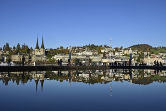 City view with St. Leodegar Court Church reflected in the fountain of the Culture and Convention