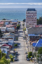 View from a hill over streets and houses to the Strait of Magellan, city of Punta Arenas,