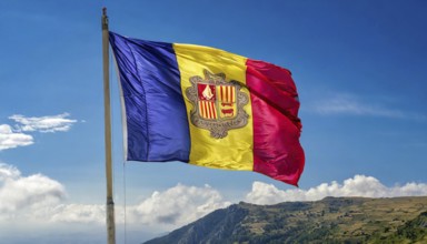 The flag of Andorra flutters in the wind