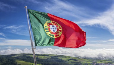 Flags, the national flag of Portugal flutters in the wind