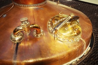 Copper whisky still, manufactured by Archibald McMillan in Edinburgh, Scotland, United Kingdom in