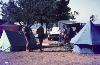 British tourists campsite on the coast with tents camping holiday in Spain, 1966