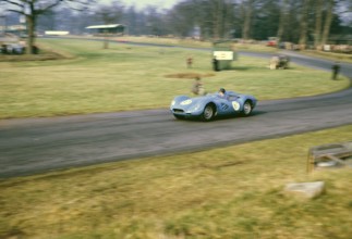 British sports racing driver Bill de Selincourt (1921 2014) at the wheel of a Lister Jaguar