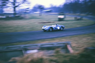 British sports racing driver Bill de Selincourt (1921 2014) at the wheel of a Lister Jaguar