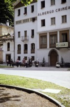 The travelling group of the Bromley Scooter Club stands in front of the Hotel Albergo Crimea,