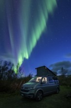 Northern lights over camper, VW California, Lyngen, Troms og Finnmark, Norway, Europe