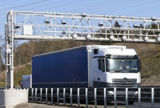 Hagen, North Rhine-Westphalia, Germany - Truck drives under toll bridge on A45 motorway