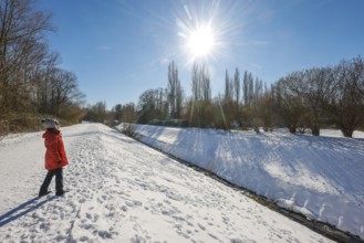 Bochum, North Rhine-Westphalia, Germany - Sunny winter landscape in the Ruhr area, walker, a senior