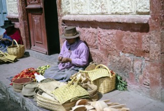 Indigenous market traders on the street, Ambato market, Ecuador, South America, 1962, South America