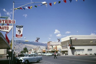 Street scene with cars and shops, Cody, Wyoming, USA 1963