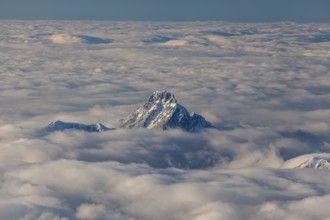 Mountain peak above high fog, evening light, winter, view from Zugspitze to Säuling, Bavarian Alps,