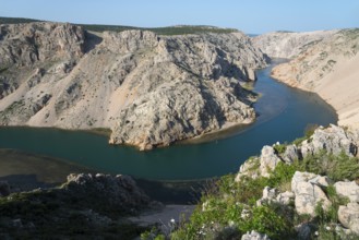 River winds through rocky canyon surrounded by lush green vegetation, Pariževacka Glavica,