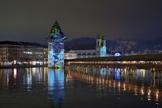 Wassertum with light installation, Chapel Bridge on the right, Jesuit Church on the Reuss at dusk