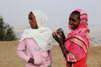 In the highlands of Abyssinia, Semien Mountains, young woman in colourful shawls, Ethiopia, Africa