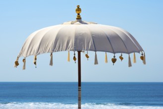 Traditional Balinese temple sunshade as parasol, sun, Hinduism, symbol, beach holiday, protection,