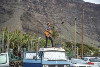 Street musician on car roof, Valle Gran Rey, La Gomera, Canary Islands, Spain, Europe