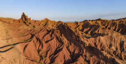 Aerial view, eroded mountain landscape, sandstone cliffs, canyon with red and orange rock