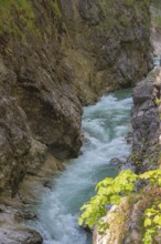 The Lammer creek is flowing fast through the Lammerklamm on a sunny hiking day