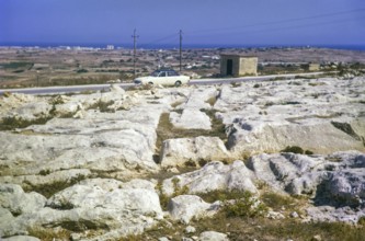 Prehistoric cart tracks crossing carboniferous limestone pavement, Malta, Europe 1971, Europe