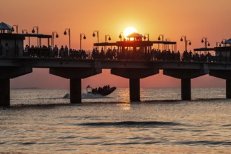 Sunset at the pier in Miedzyzdroje, Western Pomerania, Poland, East Europe, Europe