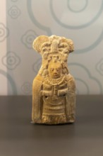 Ceramic figurine model of woman with mantle cloak, from Jaina, Late classical period, Mayan