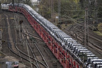 Freight train, car train with Landrover new cars on the goods train line at the Hagen-Vorhalle