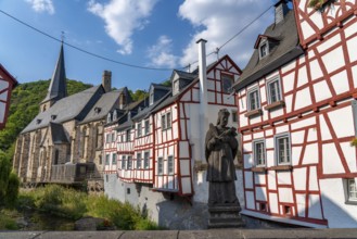 Monreal, idyllic half-timbered village in the Elz valley, figure of Nepomuk, the bridge saint, in