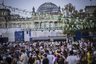 Scenes in the fan zone on Platz der Republik in front of the Reichstag building taken in Berlin, 29