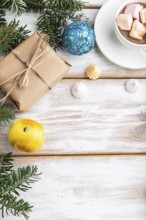 Christmas or New Year frame composition. Decorations, box, balls, cinnamon, ribbons, fir and spruce